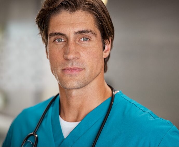 determined-young-doctor-looking-at-camera-2023-11-27-05-35-03-utc