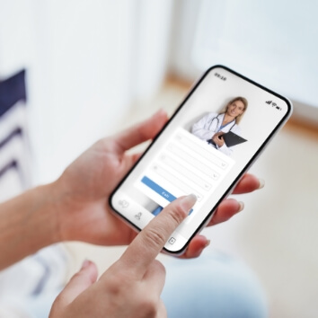 female-exploring-options-on-health-app-via-her-sma-2023-12-13-19-34-58-utc (2)